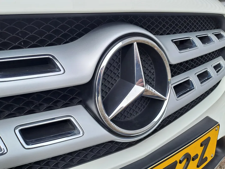 Mercedes-Benz GLA 180 Business Solution AMG AUTOMAAT | Trekhaak | Cruise | Panorama Schuif/kantel Dak | Navigatie | Camera | AMG-styling