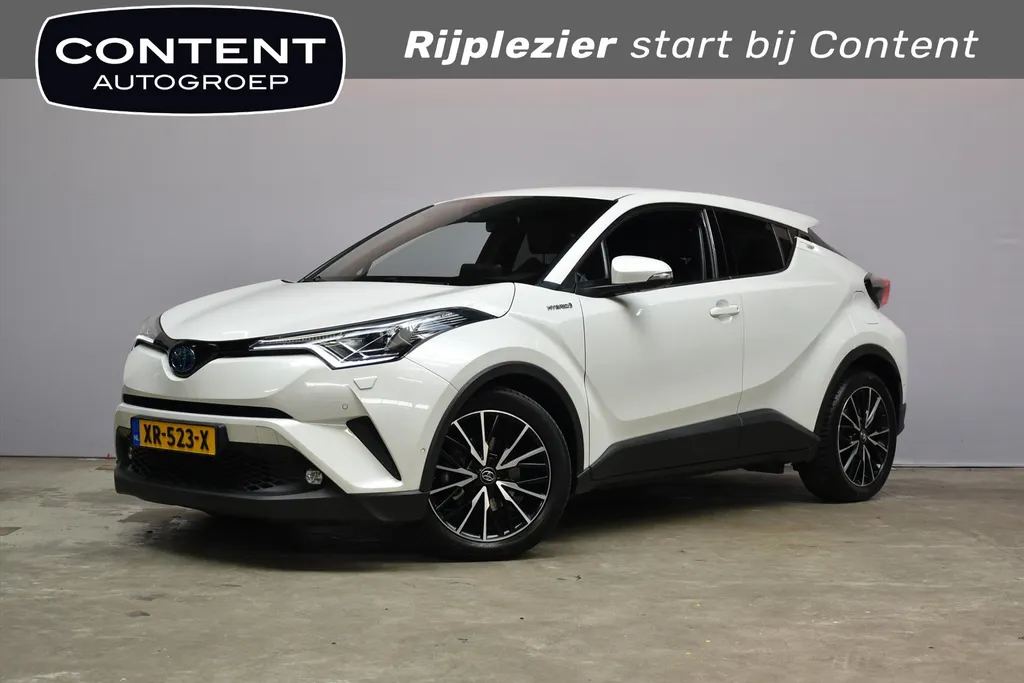 Toyota C-HR 1.8 Hybrid 122pk CVT Bi-Tone Navigatie | Cruise | Clima | PDC |Half Leer | Parlemoer Wit