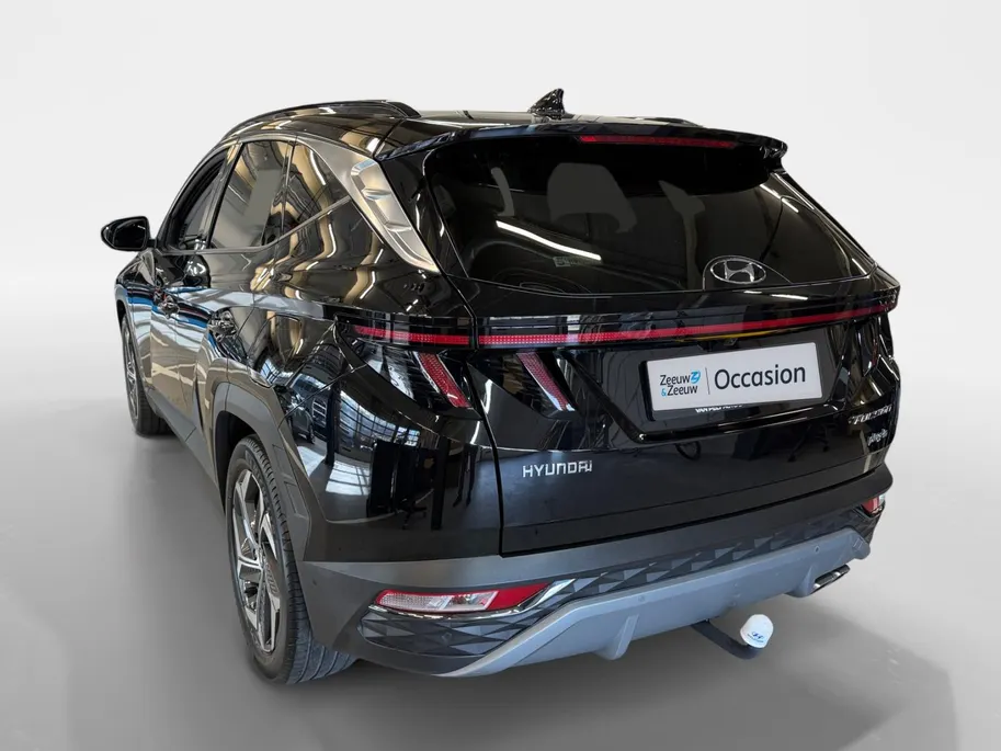 Hyundai Tucson 1.6 T-GDI PHEV Premium Sky 4WD | 66km WLTP elektrisch | Navigatie | Adaptive cruise control | Trekhaak | Apple Carplay & Android Auto | Dode hoek detectie | Draadloze telefoonlader |