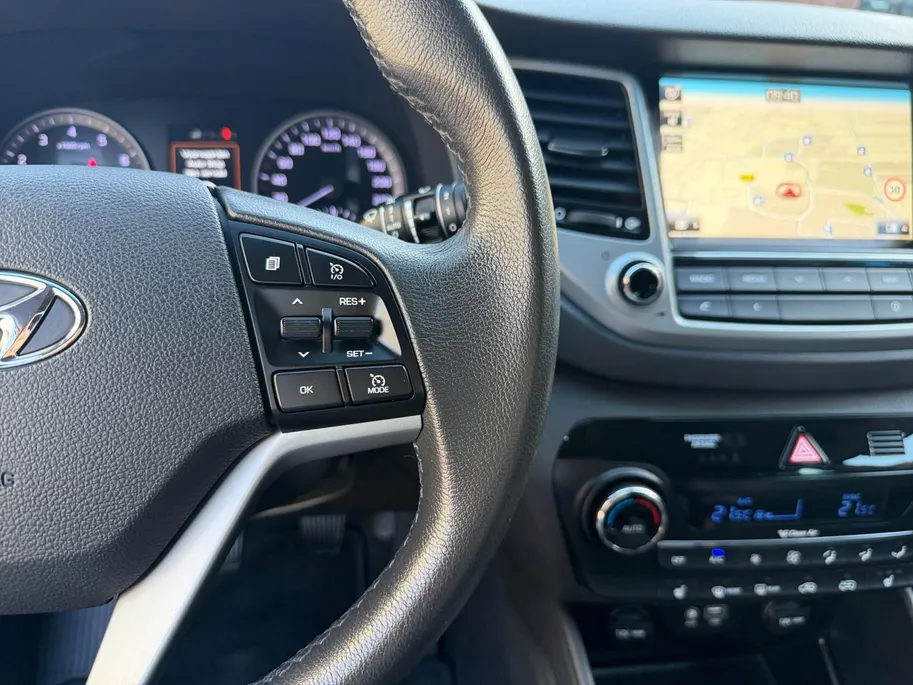 Hyundai Tucson 1.6 GDi Comfort | Elektrisch Verstelbare Stoelen | Navigatie | Bluetooth | Camera | Stoelverwarming | Cruise & Climate Control | Onderhoudshistorie | All Season Banden | 12 Maanden BOVAG Garantie