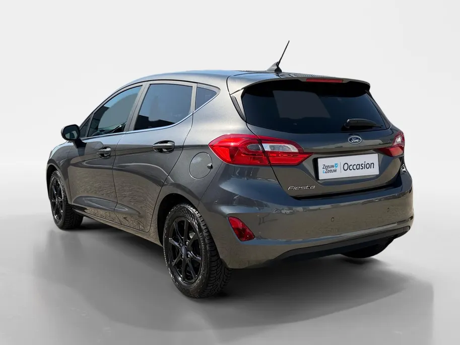 Ford Fiesta 1.0 EcoBoost Titanium | Dealer onderhouden | Winter pack | Parkeersensor achter | Apple carplay & Android auto | Navigatie via carplay | Cruise control | Elektr. inklapbare buitenspiegel | Privacy glas |