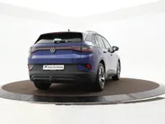 Volkswagen ID.4 Pro Business Advantage 77 kWh 204pk · SOH 95,8% · Inklap. Trekhaak · Warmtepomp · Stuur- & Stoelverwarming · 20'Velgen · ACC · Apple/Android Car Play ·