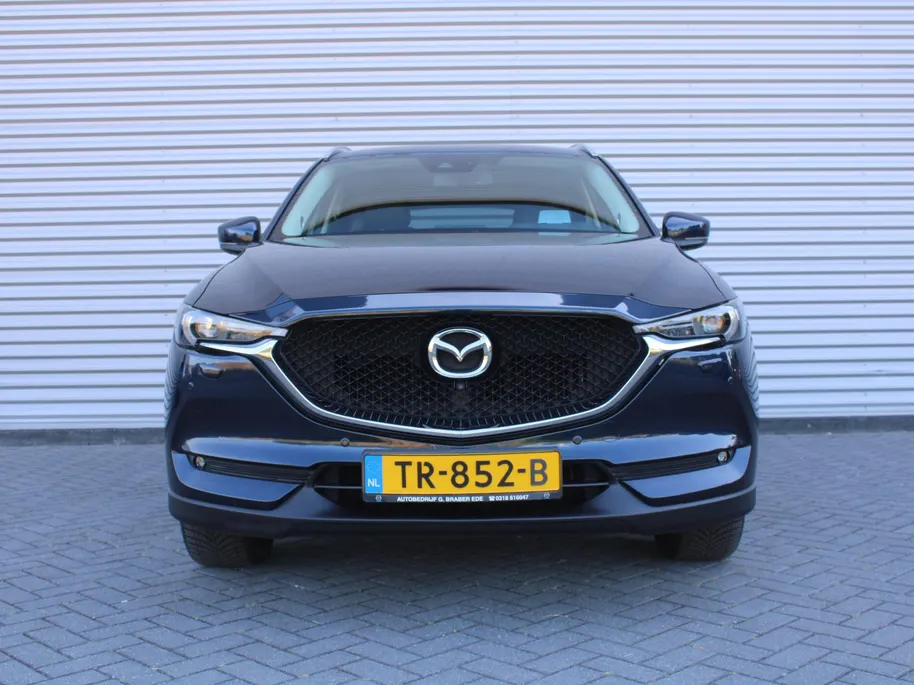 Mazda CX-5 2.0 SkyActiv-G 165 Skylease Luxury | Trekhaak | 360 Camera | Leer | Stuur-/stoelverwarming | HUD | Bose | Elek. stoelverstelling | 19' LM | All seasons |