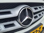 Mercedes-Benz GLA 180 Business Solution AMG AUTOMAAT | Trekhaak | Schuif/kanteldak | Navigatie | Camera | AMG-styling | Climate | Sensoren | Apple Carplay/Android Auto | Cruise | Stoelverwarming