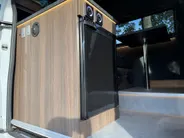 Renault Master T35 2.3 dCi 135 L3H2 Work Edition | Camper Edition | Motorsport Edition | Thule Omnistor Luifel | Airco in Leefruimte | TV | Koelkast | Magnetron | Volledig Bed | 2 Lederen Stoelen | DAB | LED Verlichting Leefruimte |