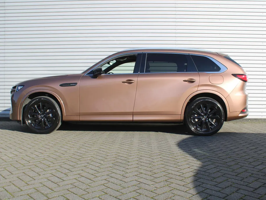 Mazda CX-80 2.5 e-SkyActiv PHEV Homura Plus | Trekhaak | Stuur-/stoelverwarming + ventilatie | 360 Camera | Schuifdak | Elek. stoelverst. | 20' LM | Leer | 7-zits |