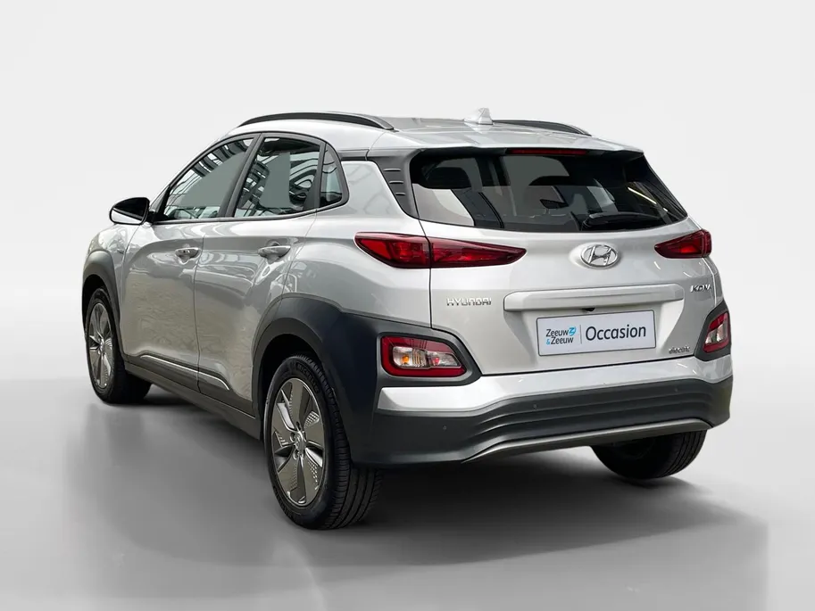Hyundai Kona EV Comfort 64 kWh | Warmtepomp | 100% SOH | Adaptive cruise control | Apple Carplay & Android Auto | Achteruitrijcamera | Parkeersensoren achter | Keyless entry | DAB radio |