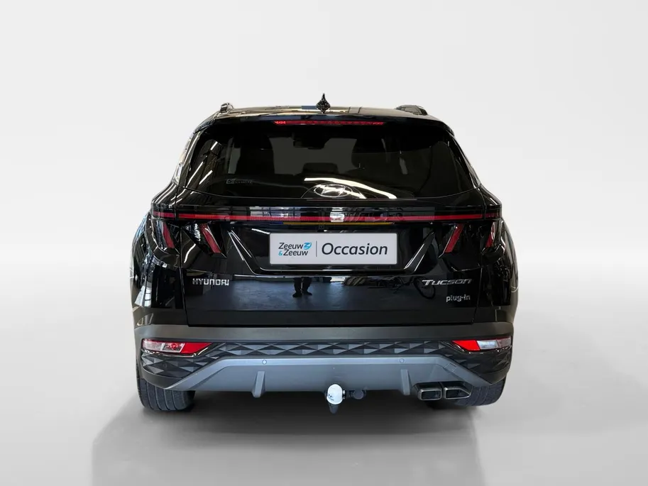 Hyundai Tucson 1.6 T-GDI PHEV Premium Sky 4WD | 66km WLTP elektrisch | Navigatie | Adaptive cruise control | Trekhaak | Apple Carplay & Android Auto | Dode hoek detectie | Draadloze telefoonlader |