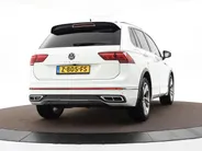 Volkswagen Tiguan 1.5 TSI 150pk DSG R-Line Business+ · Leder · Panoramadak · Apple/Android Car Play · Dodehoeksensor · Elek. Achterklep · 360 Camera · All-season banden · 19'' Inch · EXTRA INRUILKORTING ·