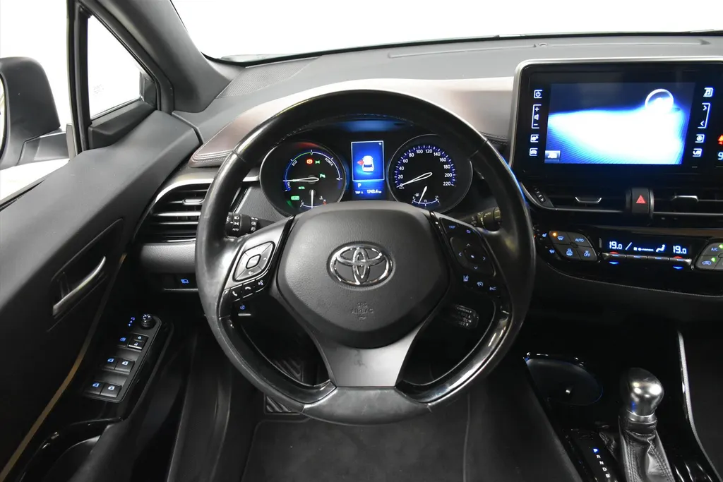 Toyota C-HR 1.8 Hybrid 122pk CVT Bi-Tone Navigatie | Cruise | Clima | PDC |Half Leer | Parlemoer Wit