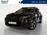 Hyundai Tucson 1.6 T-GDI PHEV Premium Sky 4WD | 66km WLTP elektrisch | Navigatie | Adaptive cruise control | Trekhaak | Apple Carplay & Android Auto | Dode hoek detectie | Draadloze telefoonlader |
