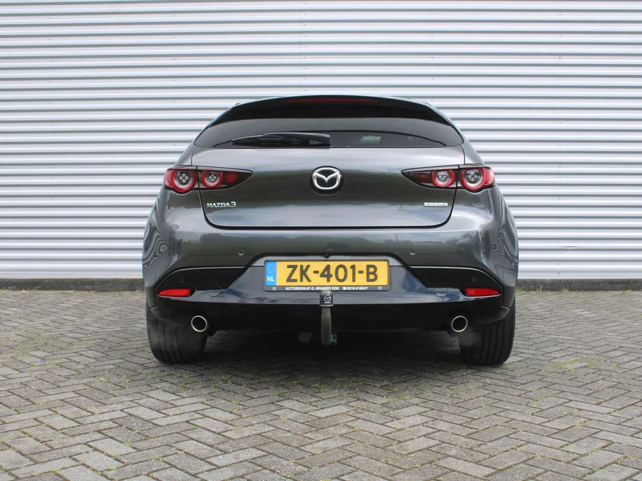 Mazda 3 2.0 e-SkyActiv-G M Hybrid 122 Luxury | Trekhaak | Stuur-/stoelverwarming | Leer | 360 Camera | Stoelgeheugen | 18' LM | HUD | LED | Cruise adapt. |