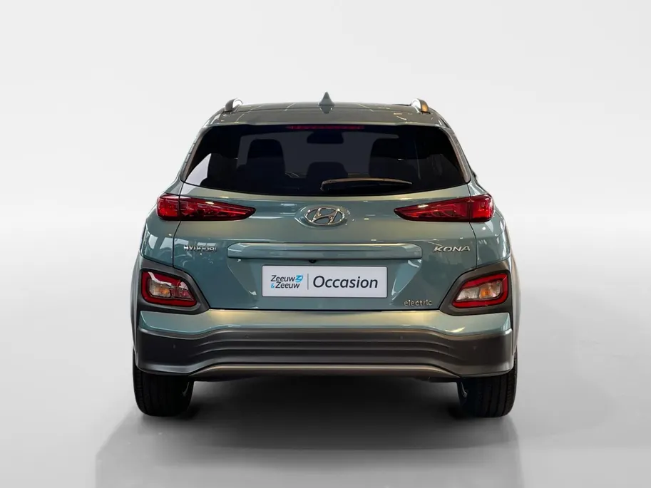 Hyundai Kona EV Fashion 64 kWh | Warmtepomp | Navigatie | Apple Carplay & Android Auto | 100% SOH | Adaptive cruise control | Climate control | Head-up display | Parkeersensoren achter |