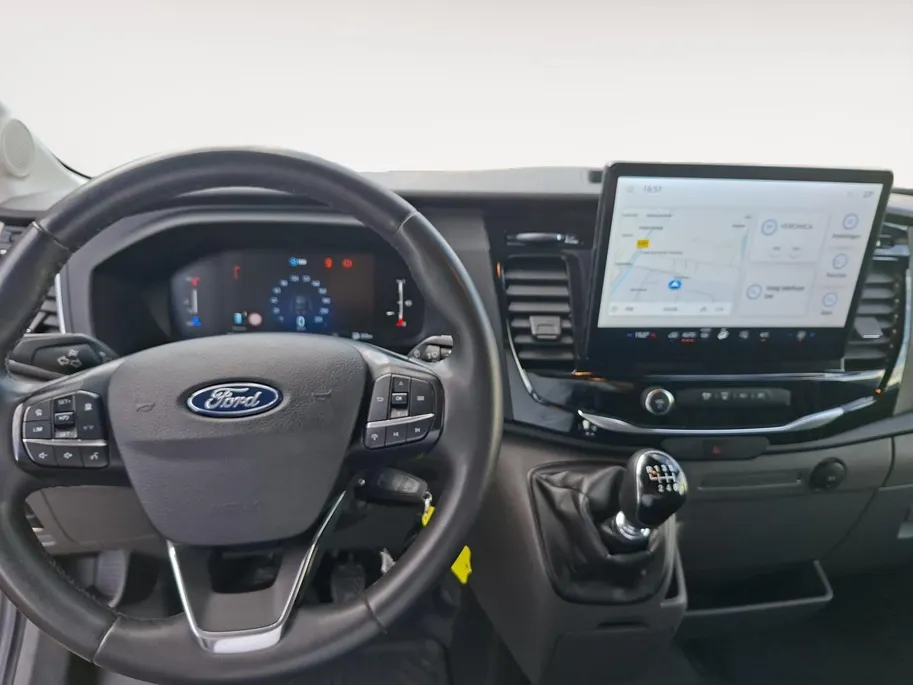 Ford Transit 350 2.0 TDCI L3H2 Trail 165 pk handgeschakeld | BPM VRIJ | Adaptive Cruise control | Navigatiesysteem | Raptor Gril | Zwarte treeplanken | LM velgen gloss black | Houten kasten links en rechts | Dakdragers met laddersysteem