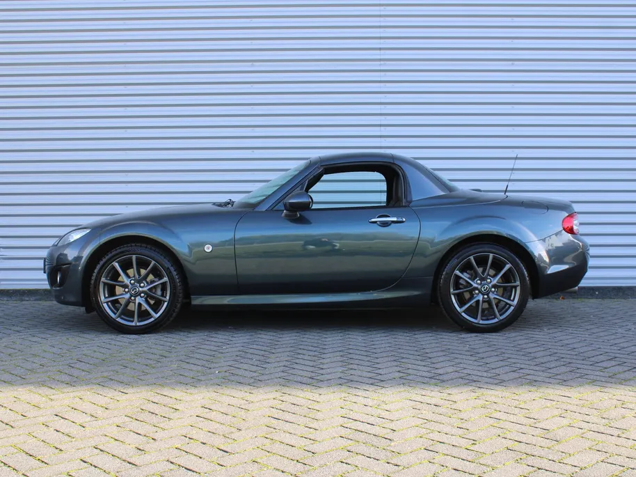 Mazda MX-5 Roadster Coupé 1.8 Hanabi | Stoelverwarming | Leer | Navi | 17" LM | Cruise | Clima | Hardtop | Nieuwstaat | Ned. auto |