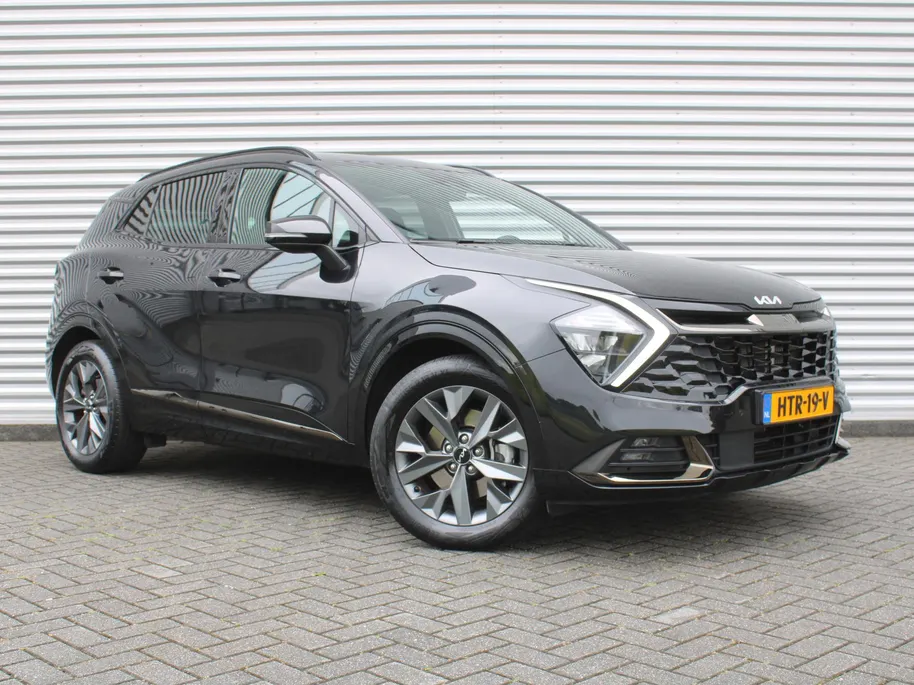 Kia Sportage 1.6 T-GDi Hybrid Dark Edition | Stuur-/stoelverwarming v+a | Camera | Elek. stoelverstelling | 18' LM | Cruise adapt. | Navi | Clima | Half leer/suède |