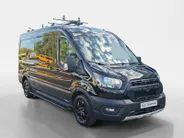 Ford Transit 350 2.0 TDCI L3H2 Trail 165 pk handgeschakeld | BPM VRIJ | Adaptive Cruise control | Navigatiesysteem | Raptor Gril | Zwarte treeplanken | LM velgen gloss black | Houten kasten links en rechts | Dakdragers met laddersysteem