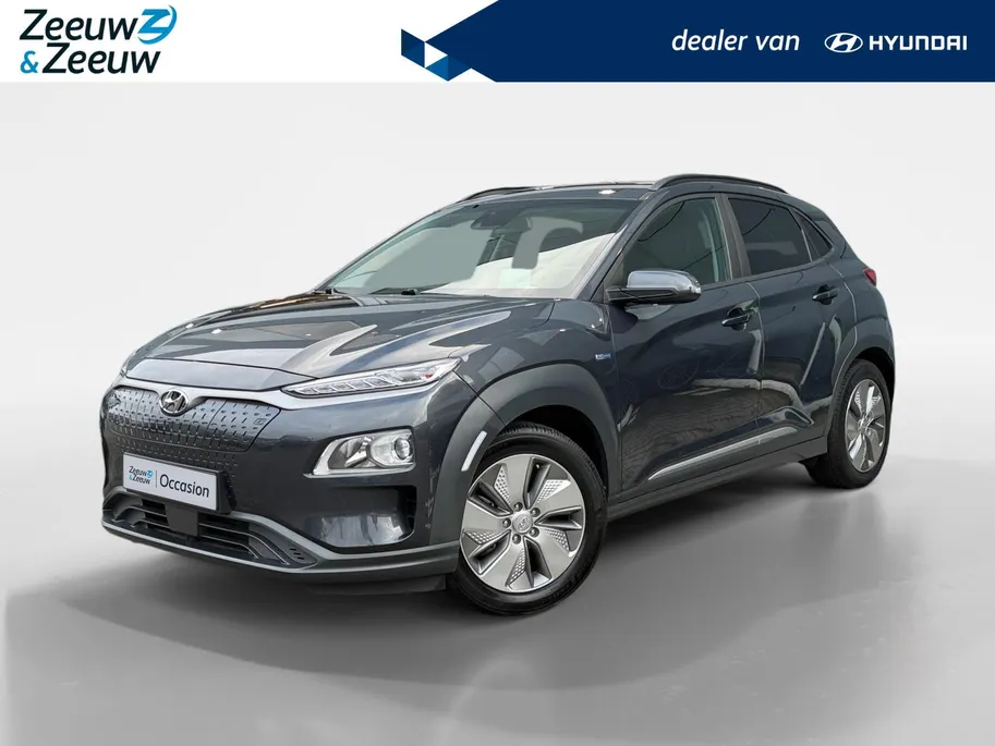 Hyundai Kona EV Fashion 64 kWh | Zeer nette auto | 100 % SOH | Stoelverwarming | Navigatie | Apple CarPlay & Android Auto | Achteruitrijcamera | Dealer onderhouden |