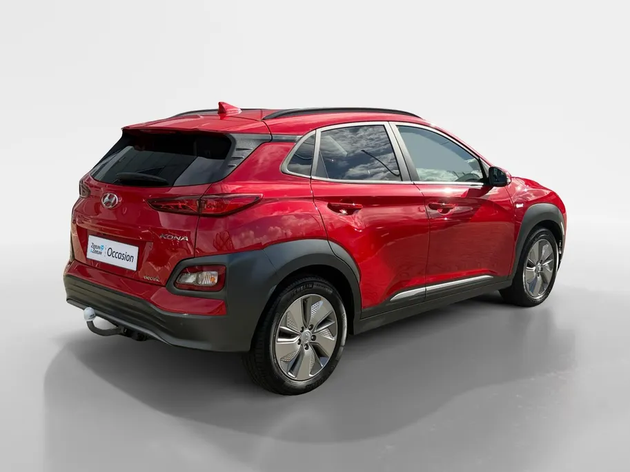 Hyundai Kona EV Fashion 64 kWh 204PK | Warmtepomp | SOH 100 % | Navigatie | Apple Carplay & Android Auto | Adaptive cruise control | Climate control | Head-up display | Parkeersensoren achter | Trekhaak |