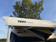 Renault Master T35 2.3 dCi 135 L3H2 Work Edition | Camper Edition | Motorsport Edition | Thule Omnistor Luifel | Airco in Leefruimte | TV | Koelkast | Magnetron | Volledig Bed | 2 Lederen Stoelen | DAB | LED Verlichting Leefruimte |
