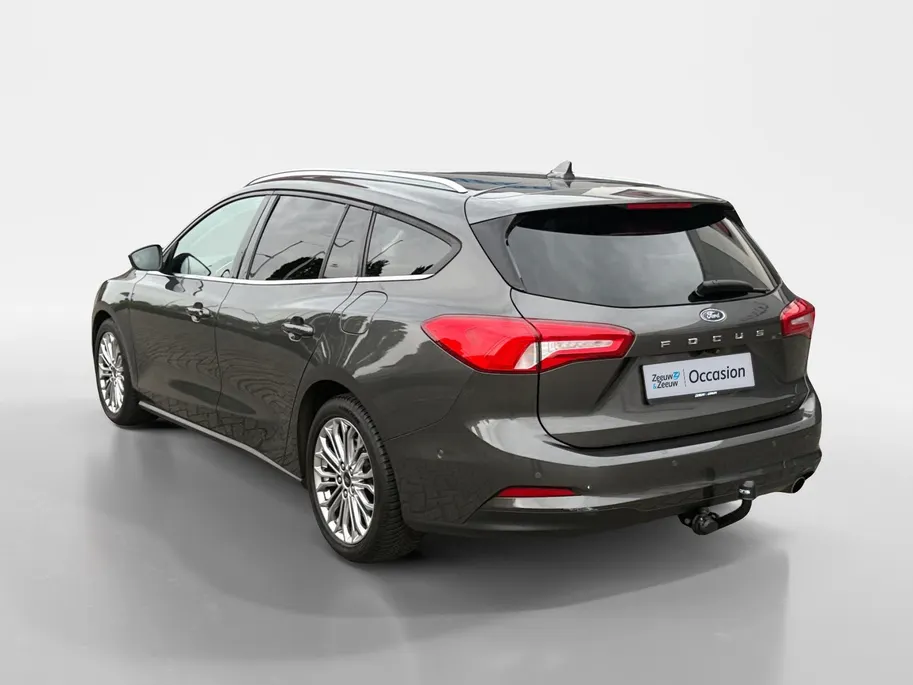 Ford Focus Wagon 1.0 EcoBoost Titanium Business | Trekhaak | HUD | Achteruitrijcamera | Winter Pack | Dodehoek detectie | Elektr. Achterklep | 12 maanden garantie! |