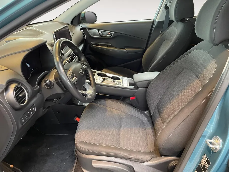 Hyundai Kona EV Fashion 64 kWh | Warmtepomp | Navigatie | Apple Carplay & Android Auto | 100% SOH | Adaptive cruise control | Climate control | Head-up display | Parkeersensoren achter |