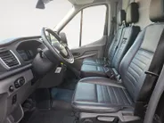Ford Transit 350 2.0 TDCI L3H2 Trail 165 pk handgeschakeld | BPM VRIJ | Adaptive Cruise control | Navigatiesysteem | Raptor Gril | Zwarte treeplanken | LM velgen gloss black | Houten kasten links en rechts | Dakdragers met laddersysteem