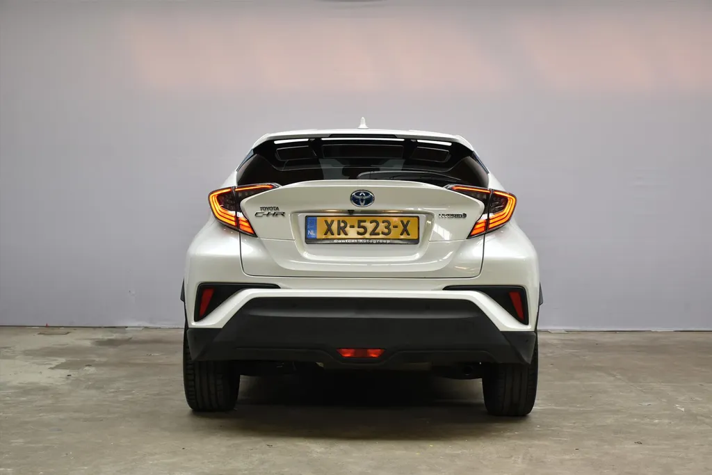 Toyota C-HR 1.8 Hybrid 122pk CVT Bi-Tone Navigatie | Cruise | Clima | PDC |Half Leer | Parlemoer Wit