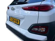 Hyundai Kona EV Fashion 64 kWh 204PK | Warmtepomp | Navigatie | Apple Carplay & Android Auto | Adaptive cruise control | Open dak | Head-up display | Achteruitrijcamera |
