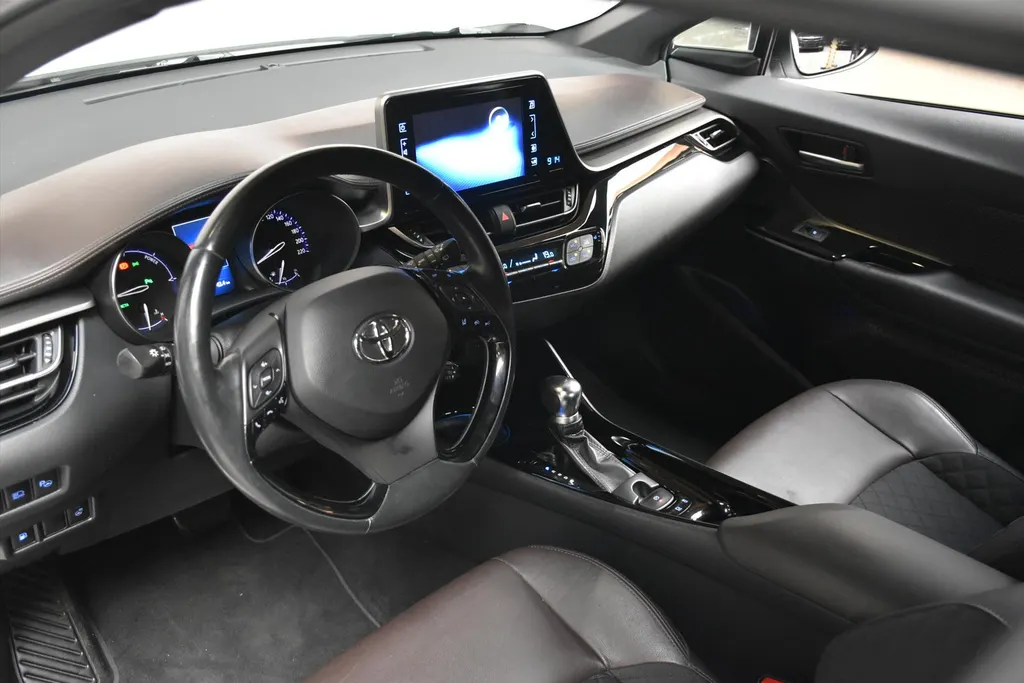 Toyota C-HR 1.8 Hybrid 122pk CVT Bi-Tone Navigatie | Cruise | Clima | PDC |Half Leer | Parlemoer Wit